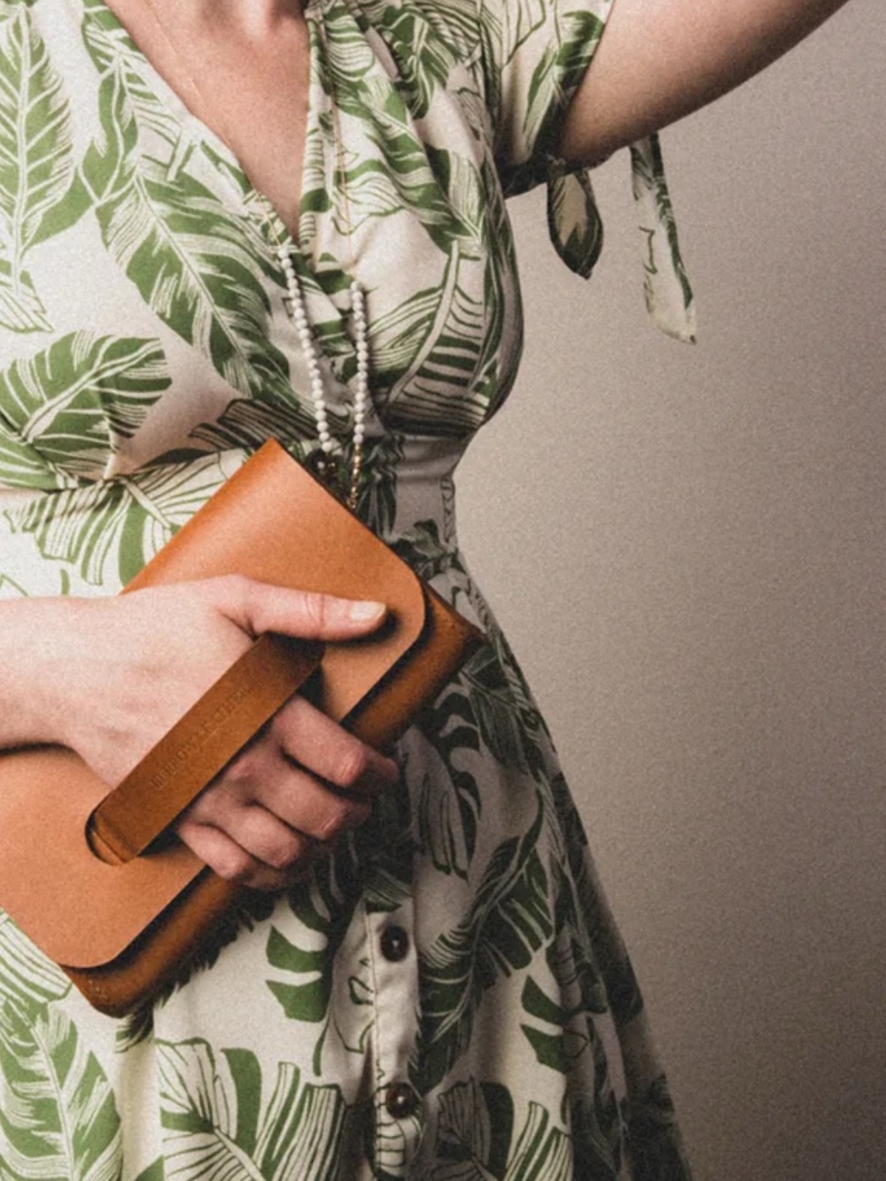 Handheld Leather Wristlet Clutch in Cognac